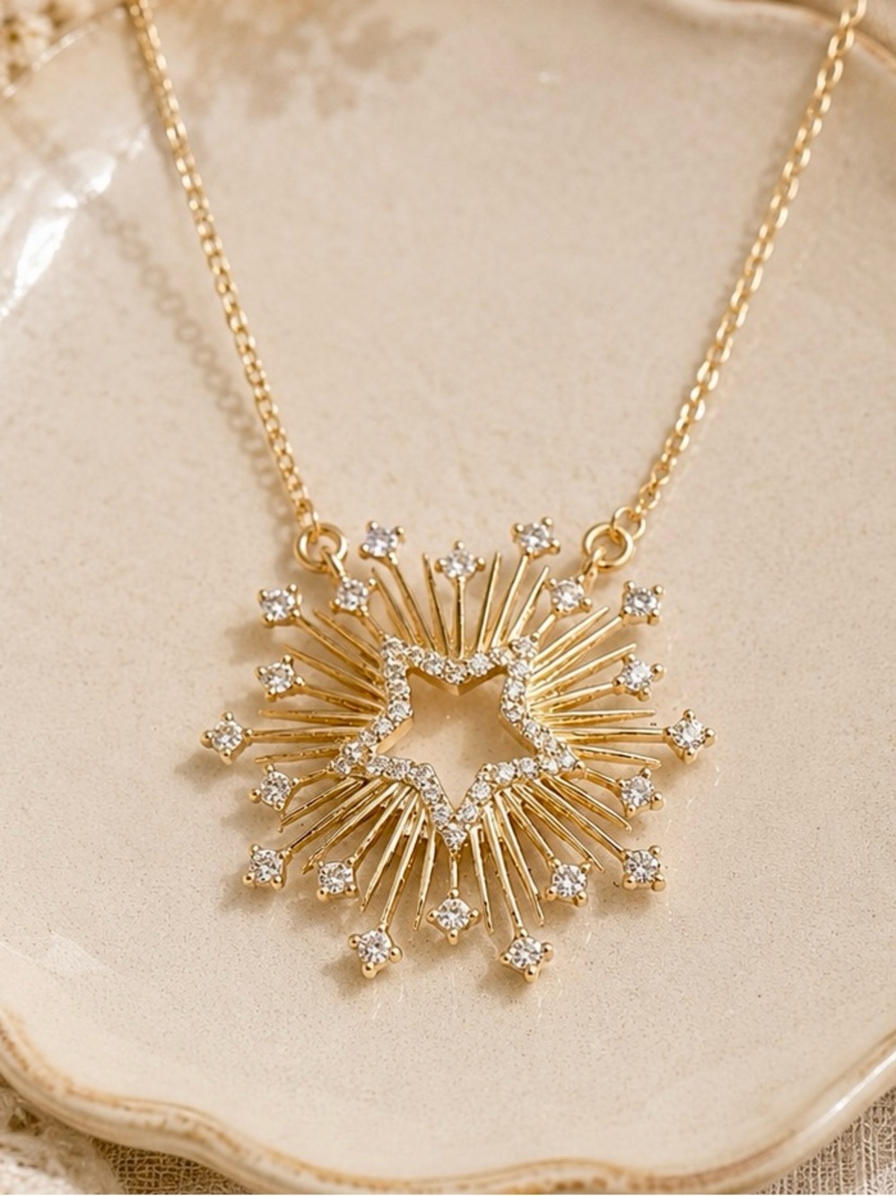 Gold Starburst Necklace with Crystal Accents